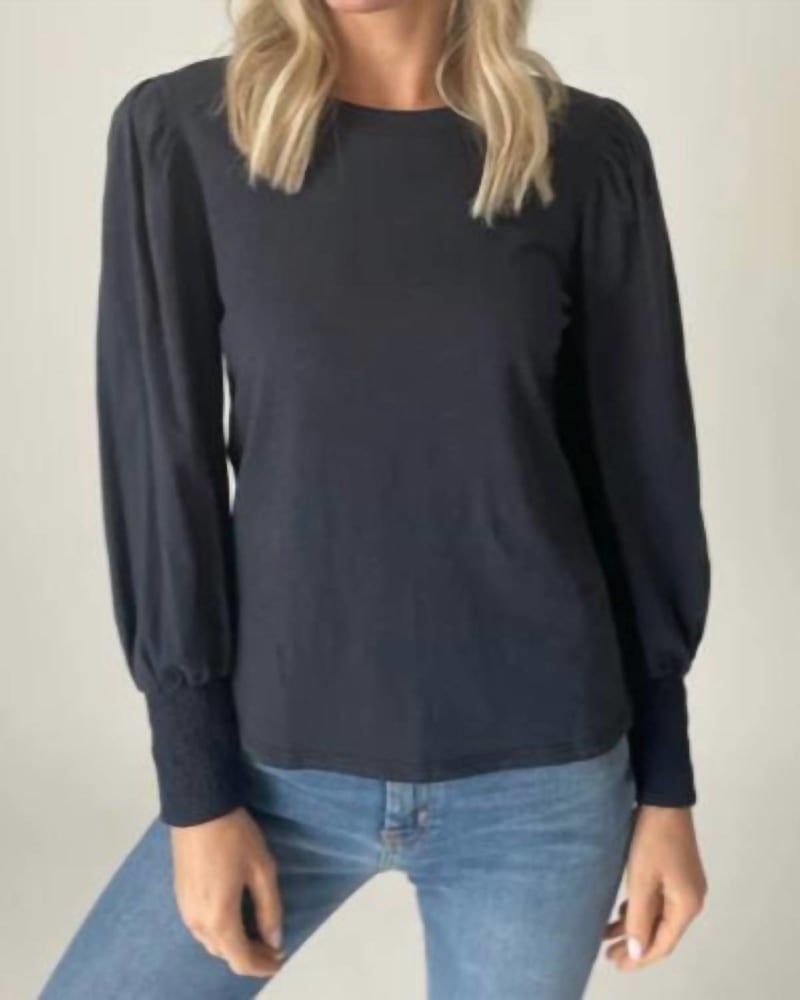 Front of a model wearing a size L Erika Long Sleeve Puff Shoulder Top in Navy in Navy by SIX/FIFTY. | dia_product_style_image_id:333912